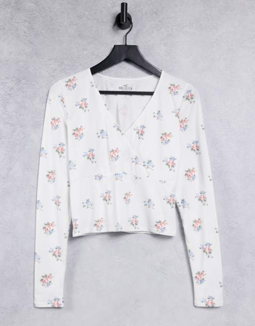 Hollister long sleeve v neck top in white floral ASOS
