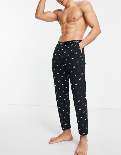 Hollister lounge sweatpants in black all over logo and logo waistband