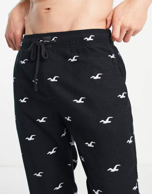 Hollister lounge sweatpants in black with all over logo
