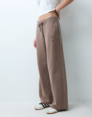Hollister Low Rise Baggy Joggers With Side Logo Graphic In Gray