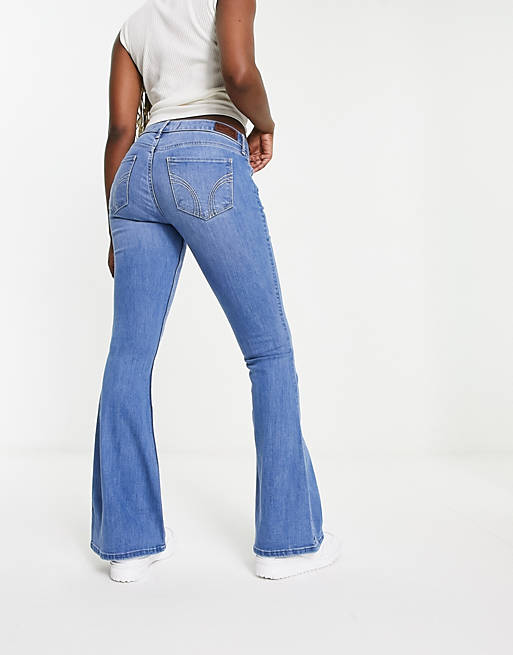 Hollister low rise flared jeans in mid blue | ASOS