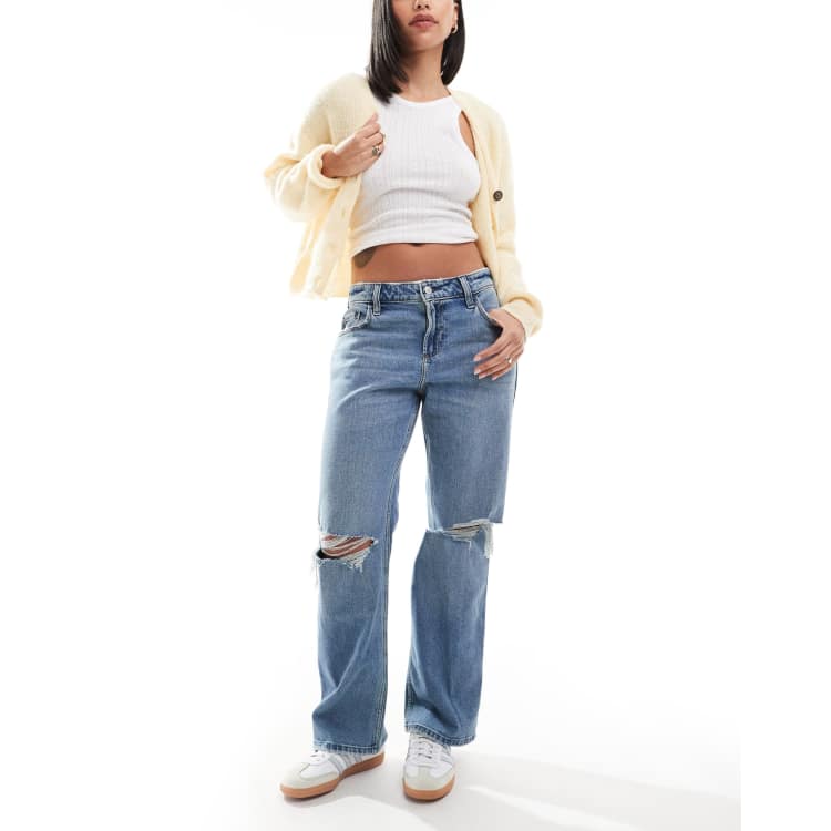 Hollister low rise relaxed straight fit jeans with knee rips in mid blue