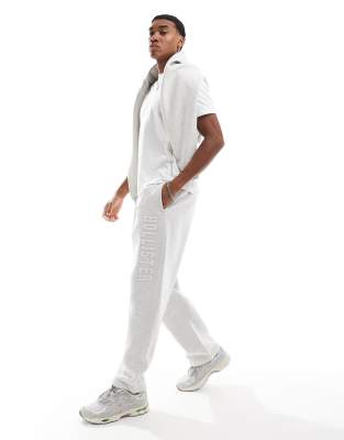 Hollister - Pantalon de jogging d'ensemble droit coupe baggy à logo - Gris