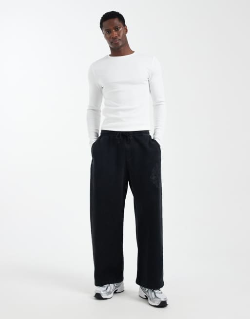 Hollister - Pantalon de jogging ultra-baggy à imprimé graphique - Noir acidulé