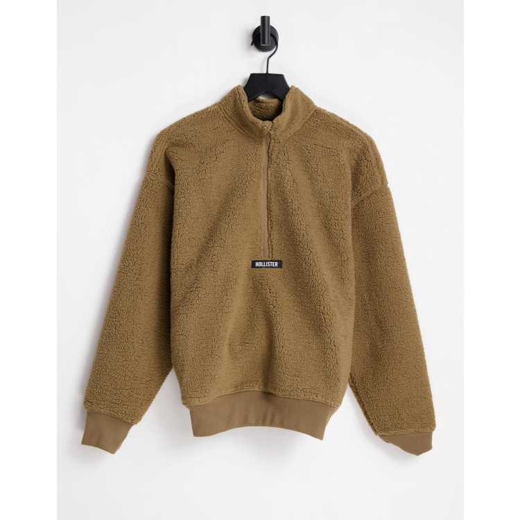 Hollister polar fleece half zip with chest logo in tan | ASOS