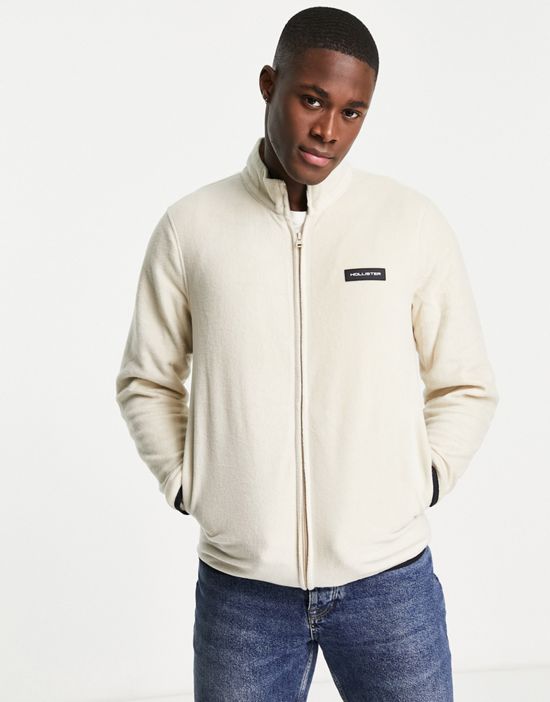 https://images.asos-media.com/products/hollister-polar-fleece-zip-through-sweatshirt-in-cream-with-chest-logo/201602192-1-neutral?$n_550w$&wid=550&fit=constrain