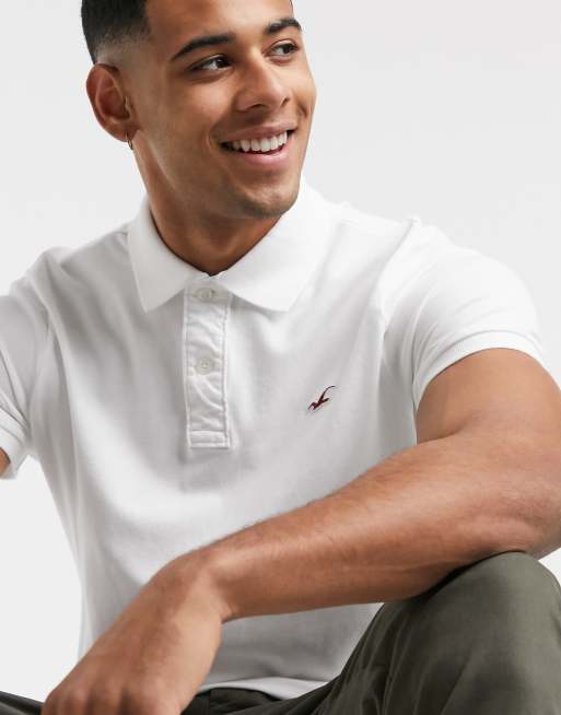 Hollister - Polo in piqué bianco con logo icona 