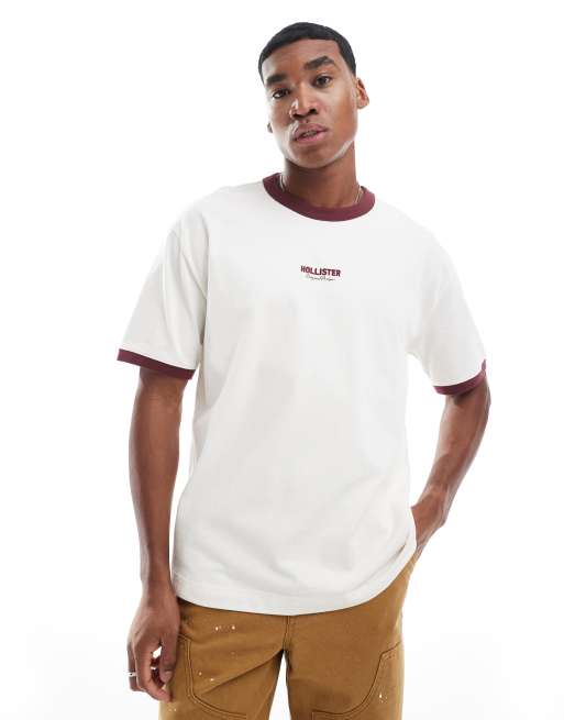 Hollister - Recht hoogsluitend T-shirt met logo en contrasterende biezen in beige