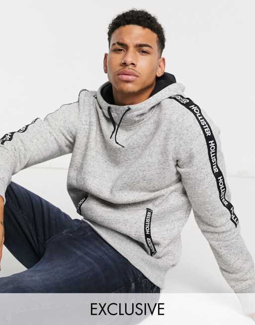 Hollister regular fit hoodie in grey with chest logo and sleeve taping  exclusive to ASOS, ASOS