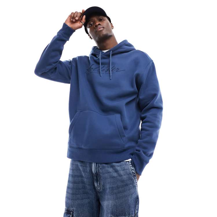 Hollister relaxed fit hoodie with embroidered chest logo in blue