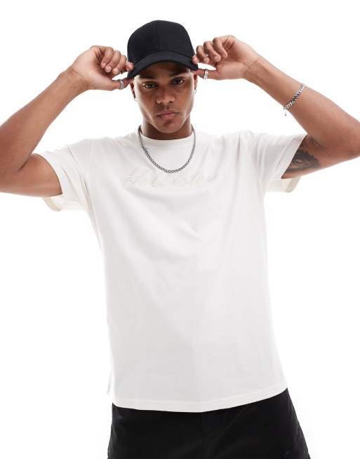 Hollister - Ruimvallend T-shirts met geborduurd logo op de borst in crème