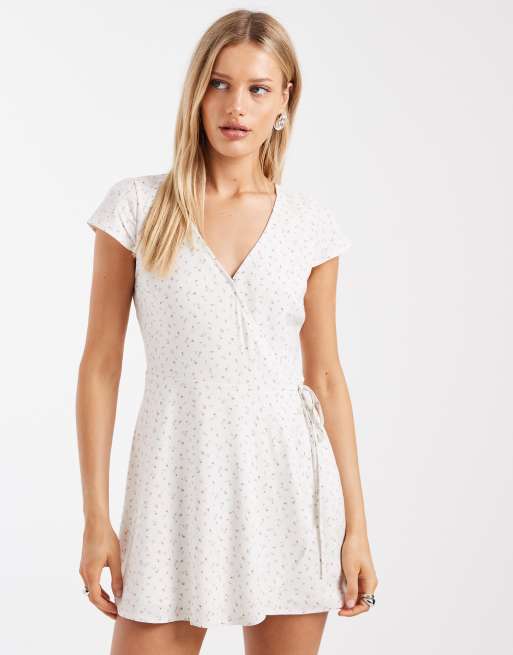 Hollister short sleeve wrap mini dress in white floral