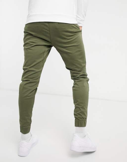 Hollister Print Logo Camo Print Skinny Joggers In Olive Green Camo, $32, Asos