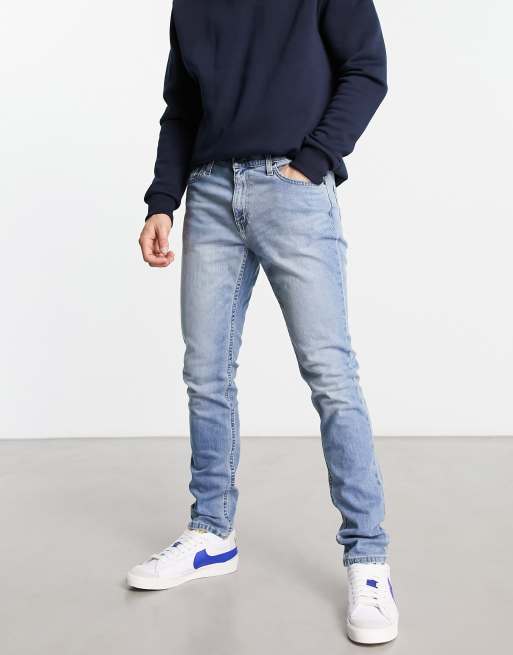 Hollister - Skinny-fit jeans met distressed details in mid-wash blauw