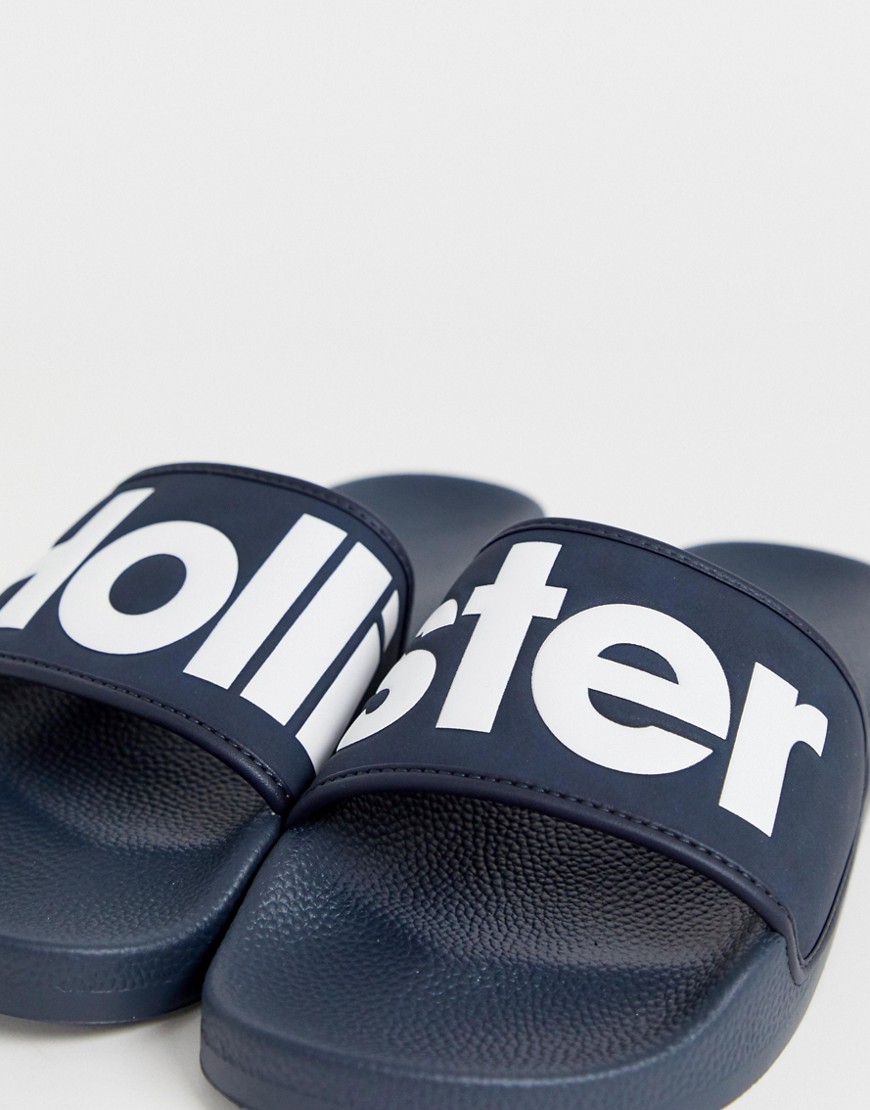 Hollister - Slider blu navy con logo grande