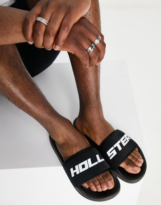 Hollister sliders in black with reflective logo