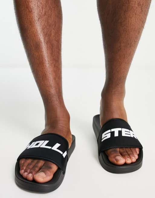 Hollister sliders in black with reflective logo