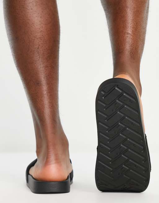 Hollister slides in black with reflective logo