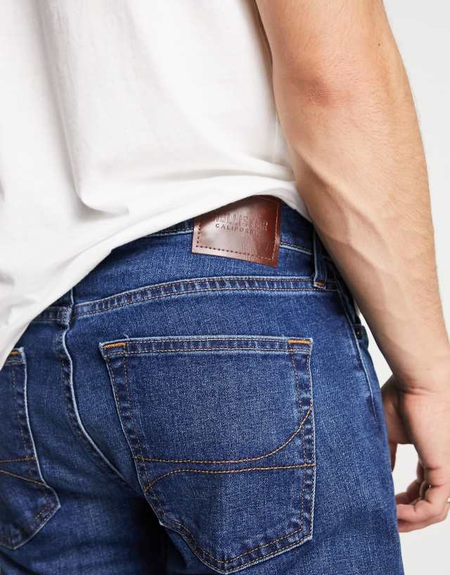 Hollister slight distressed slim straight fit jeans in dark wash 1