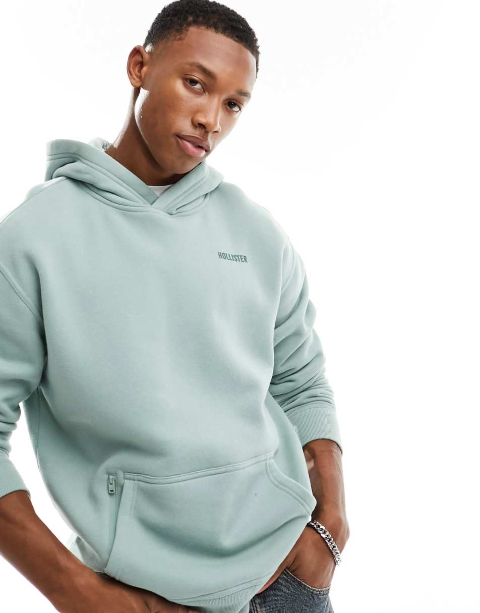 Hollister small scale logo relaxed fit hoodie with zip pocket in sage green