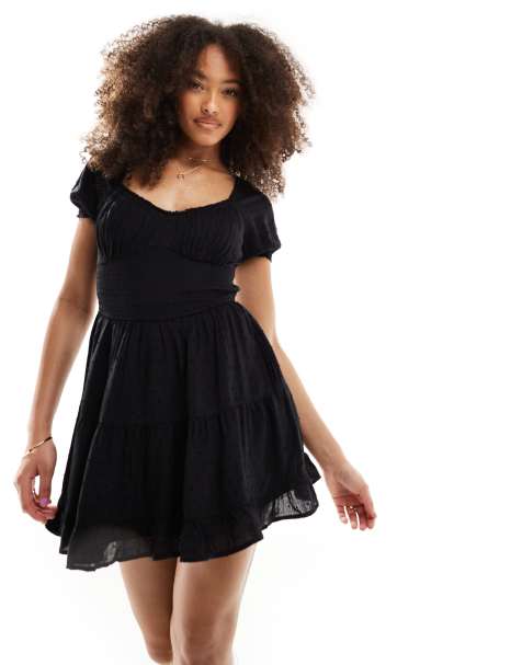 Hollister smocked waist mini dress with pockets and hidden shorts in black - view 1