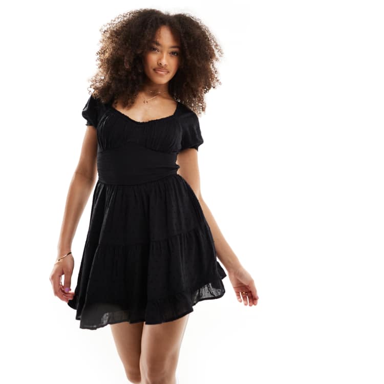 Hollister smocked waist mini dress with pockets and hidden shorts in black  | ASOS