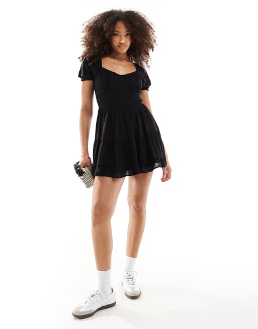 Hollister smocked waist mini dress with pockets and hidden shorts in black ASOS