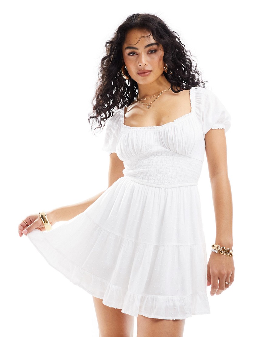 Hollister smocked waist mini dress with pockets and hidden shorts in white