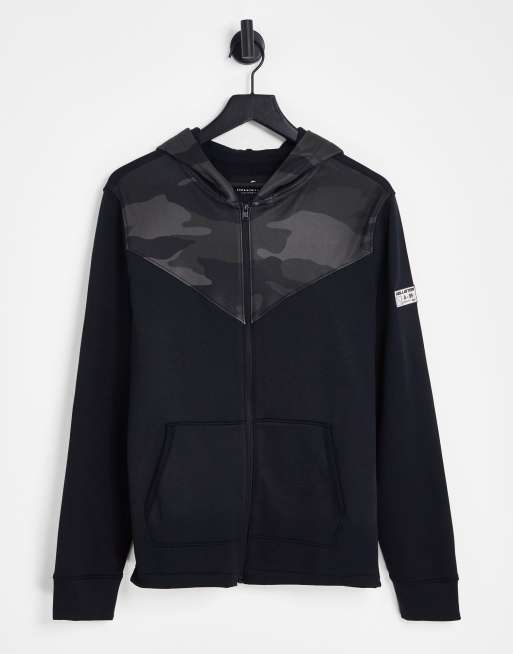 Hollister – Sportlicher Kapuzenpullover in Schwarz mit durchgehendem Reißverschluss und Camouflage-Muster im Farbblock-Design