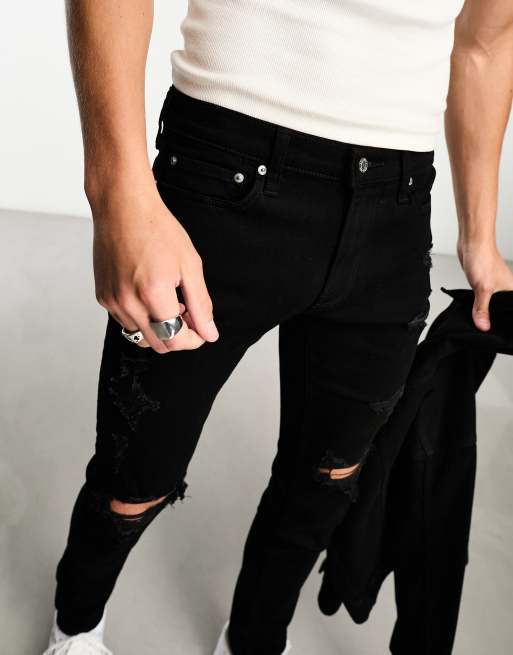 Black ripped jeans hollister discount