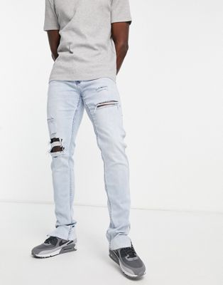 Hollister stacked skinny fit distressed/repair jeans in light wash