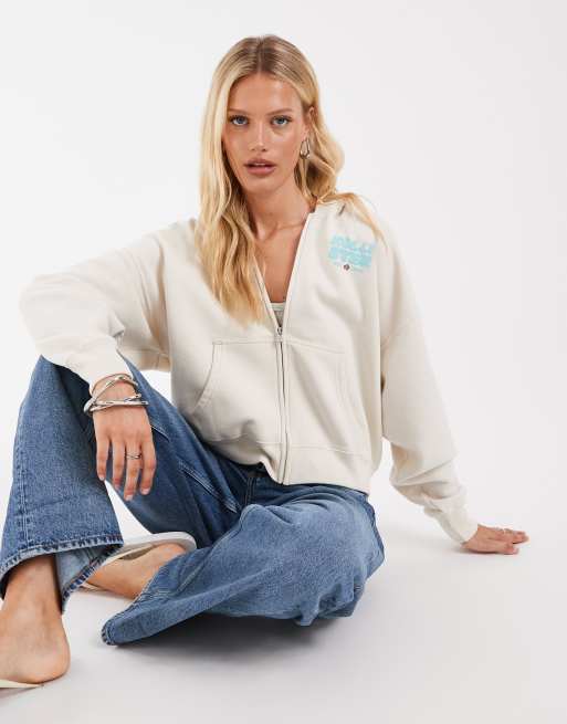 Hollister - Sudadera con capucha y cremallera trasera en crema