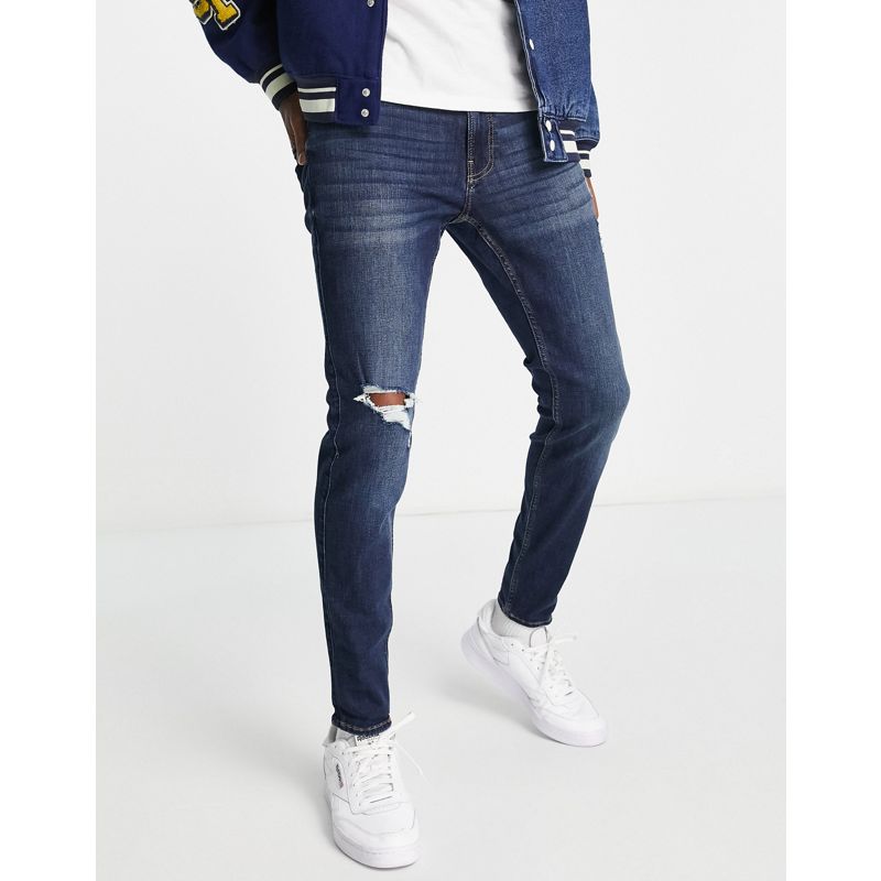 Hollister – Superenge Jeans in hell-dunkler Waschung im Used-Look mit Loch am Knie