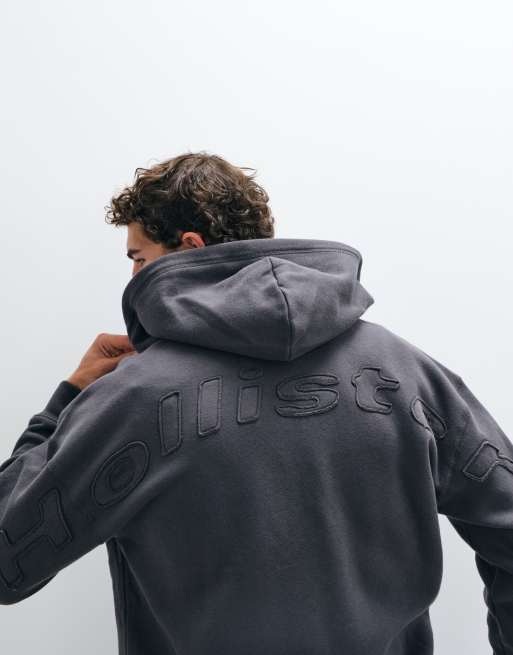 Hollister sweat à capuche zippé avec logo graphique au dos en noir délavé, 1 de 5