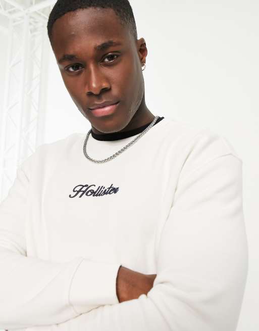 Hollister – Sweatshirt in Cremeweiß mit Logo-Schriftzug