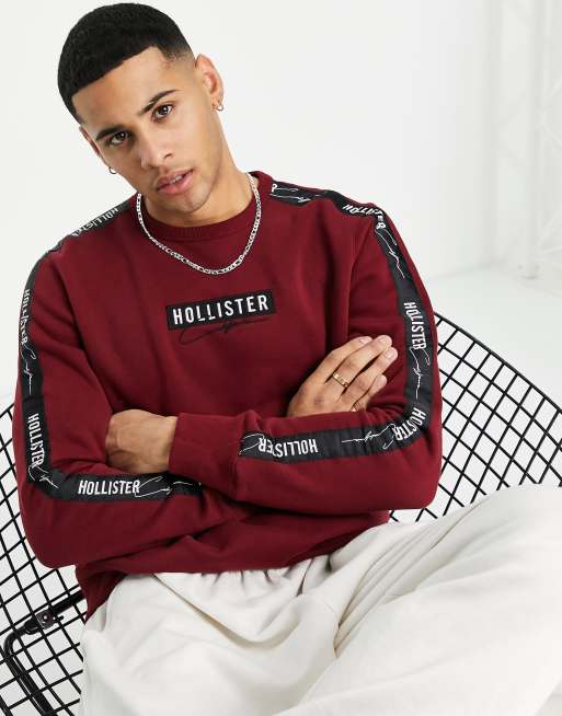 Hollister - Sweatshirt met logobies op de mouwen in bordeauxrood