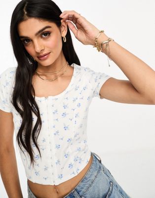 Hollister t-shirt with hook and eye front detailing in floral print - ASOS Price Checker