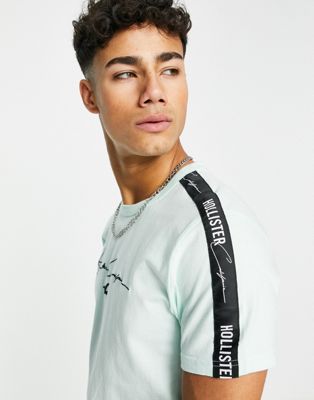 Homme Hollister - T-shirt avec inscription sur le devant et bande logo ton sur ton - Menthe