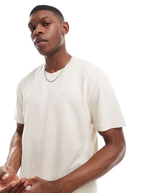 Hollister - T-shirt décontracté à logo en tissu quadrillé texturé - Beige