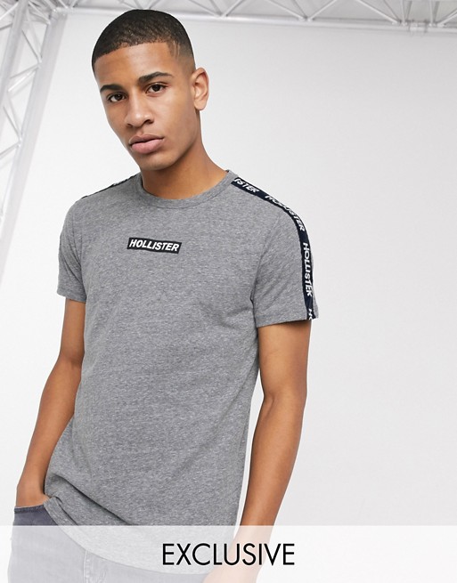 Hollister t-shirt in grey with chest logo and sleeve taping exclusive to ASOS