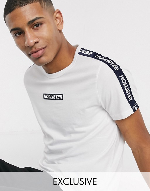 Hollister t-shirt in white with chest logo and sleeve taping exclusive to ASOS