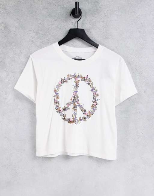 Hollister - T-shirt met gestrikte voorkant en slogan met vredesteken in wit