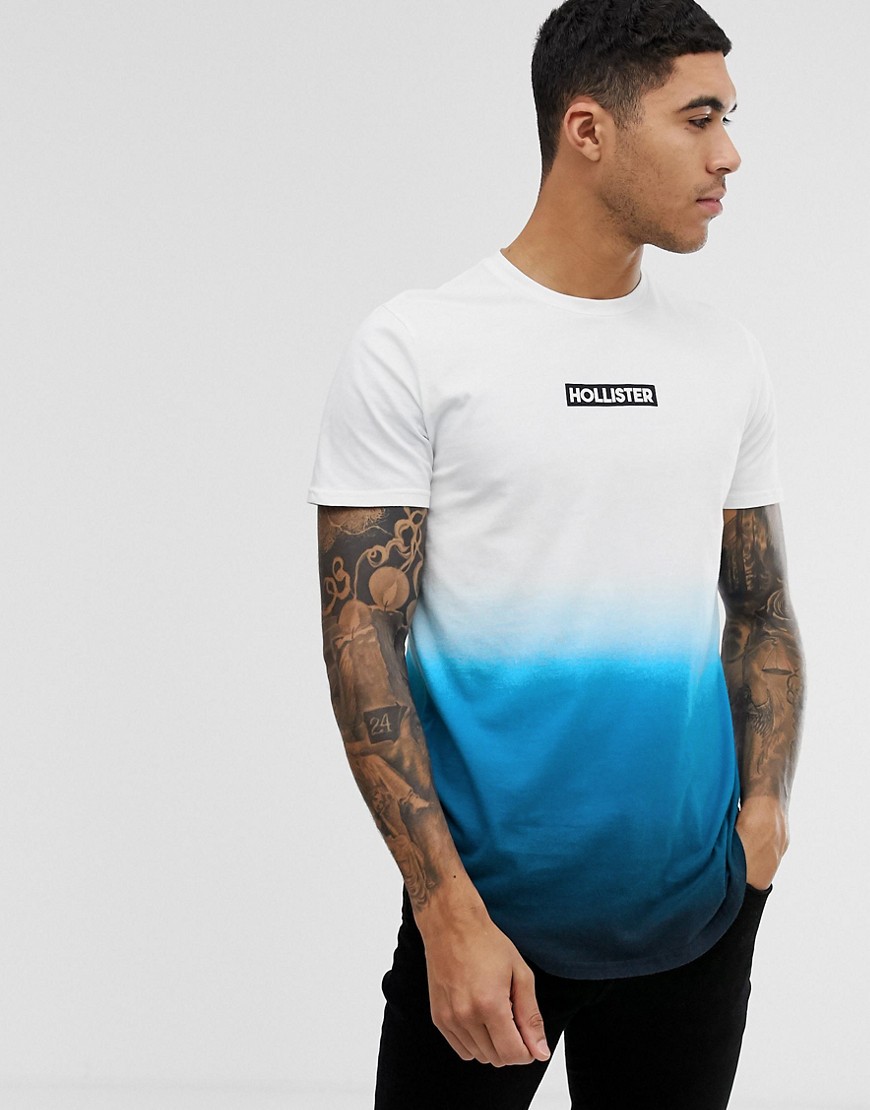 Hollister - T-shirt met logo, ronde zoom en dip-dye in wit met marineblauw