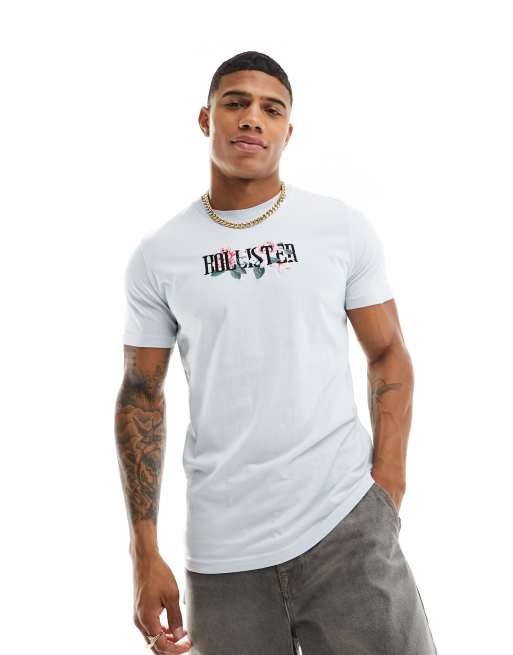 Hollister - T-shirt met print en geborduurde bloemen in lichtblauw