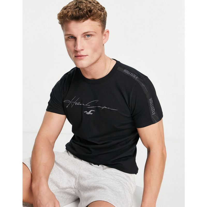 T-shirt e Canotte MvjbF Hollister - T-shirt nera con scritta sul davanti e logo a fettuccia tono su tono