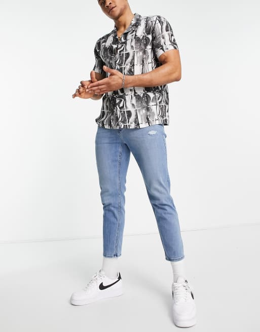 Hollister tapered crop fit knee distressing jeans in mid wash