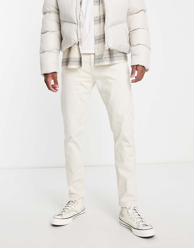 Hollister tapered jeans in off white