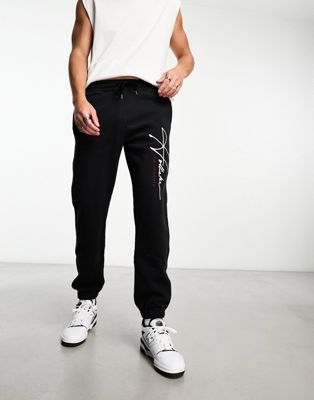 Hollister tech leg logo relaxed fit cuffed joggers in black