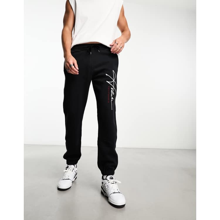 Hollister tech leg logo relaxed fit cuffed joggers in black