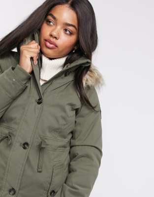 khaki parka with black fur hood